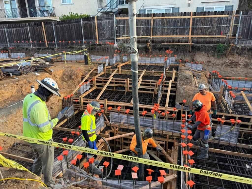 Reinforced concrete foundation construction at a construction site.