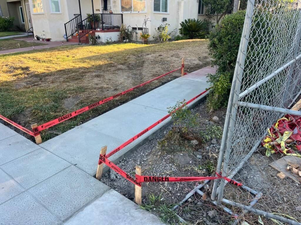 Concrete sidewalk construction in progress by West Dynamic Concrete Inc., ensuring durable and quality concrete work.