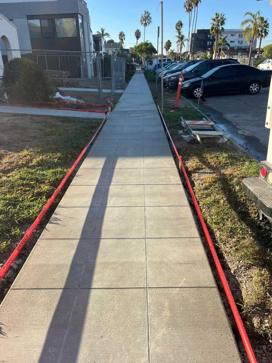 Concrete sidewalk installation by West Dynamic Concrete Inc. in progress, showcasing durable and high-quality concrete work.